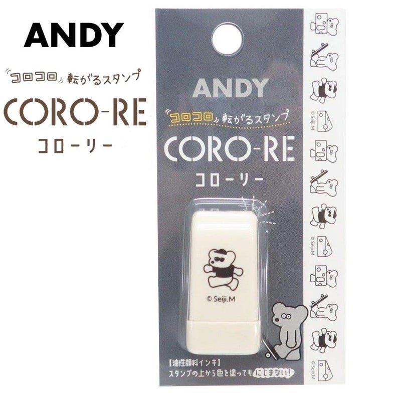 Puede incluir: Un sello rectangular blanco con una ilustraci&oacute;n de oso y el texto "CORO-RE" en marr&oacute;n. El embalaje incluye la marca "ANDY" y texto japon&eacute;s. El sello est&aacute; en una funda de pl&aacute;stico transparente.