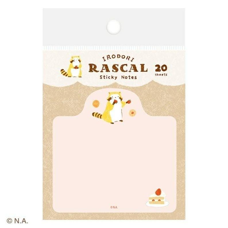 May include: A package of "IRIDORI RASCAL Sticky Notes" with a cartoon raccoon illustration. The notes have a light pink background with a light brown border and a small cake illustration. The package contains 20 sheets.