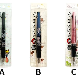 May include: Three Jetstream 21 pens in black, blue, and pink with a bear school theme. Each pen has a 0.5 mm tip and is packaged in a clear plastic sleeve.