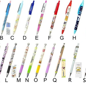 May include: A set of 19 colorful mechanical pencils featuring Peanuts characters. The pencils have different designs and colors, including red, blue, green, yellow, and pink. Some pencils have a ballpoint tip, while others have a standard pencil tip. The pencils are all approximately 14 cm long.