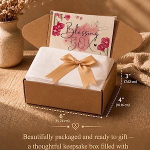 May include: A brown rectangular keepsake box, 6" x 4" x 3", with a gold bow and a card that reads "Blessing Box." The box is filled with white tissue paper. The text below the box says "Beautifully packaged and ready to gift".