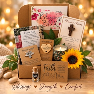 May include: A cardboard Blessing Box containing a small prayer quilt, a wooden cross charm, a metal angel pendant, a heart-shaped token, a candle in a patterned glass, a sunflower, and a glass vial with gold beads, all labeled with faith-themed text.
