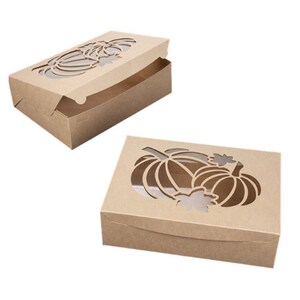 May include: Two brown cardboard boxes with cut-out pumpkin designs. The boxes are open and show the inside of the boxes.