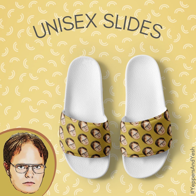 May include: White unisex slides with a yellow strap featuring a repeating image of a man's face. The slides are on a yellow background with a repeating white arc pattern. The text "UNISEX SLIDES" is at the top.