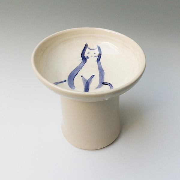 Raised cat feeder on a pedestal with blue cat design, Elevated ceramic cat bowl