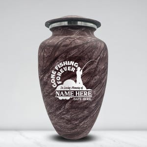 May include: A maroon-colored urn with a lid and a silver rim. The urn features a white graphic of a fisherman and the text "GONE FISHING FOREVER", "In Loving Memory of NAME HERE DATE HERE".