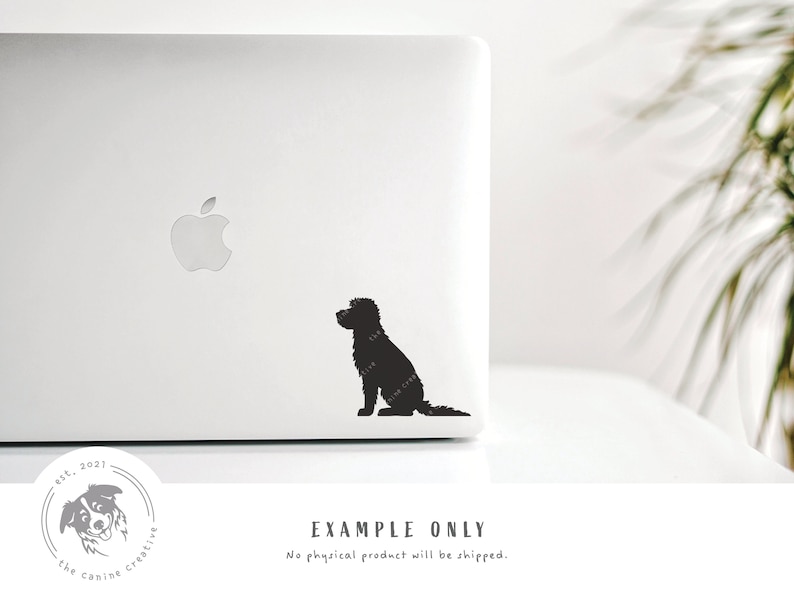 May include: A black silhouette of a dog sitting on a white laptop. The dog is facing to the left and has a long tail. The laptop has an apple logo on the lid.