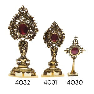 May include: Three ornate, gold-colored religious display pieces with red center stones. The pieces vary in size and design, with intricate floral and angel details. The numbers 4032, 4031, and 4030 are printed at the base of each piece.