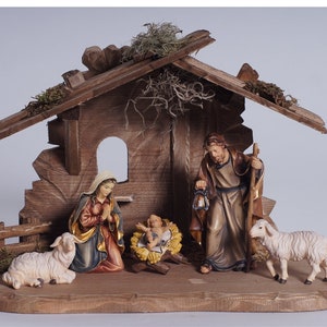 Complete wooden nativity scene with hut created in Val Gardena
