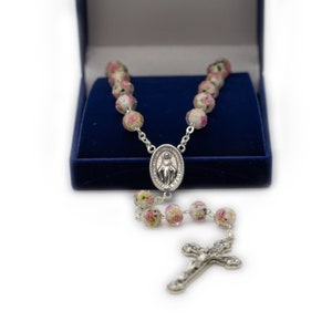 Crystal rosary with the Miraculous Madonna Medal.