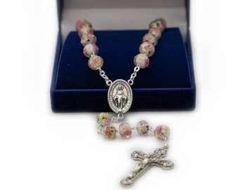 Crystal rosary with the Miraculous Madonna Medal.