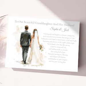 May include: A wedding card with a watercolor illustration of a couple walking away, holding hands. The card reads "To Our Beautiful Granddaughter And Her Husband Sophie & Jack" with a poem below. The card is white with a soft, romantic aesthetic.