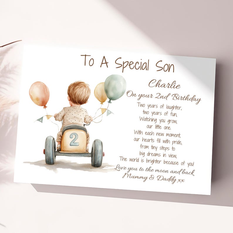 May include: A personalized birthday card for a son turning two years old. The card features a watercolor illustration of a boy riding a toy car with balloons and the text "To A Special Son Charlie On your 2nd Birthday Two years of laughter, two years of fun, Watching you grow, our little one. With each new moment, our hearts fill with pride, from tiny steps to big dreams in view, The world is brighter because of you! Love you to the moon and back Mummy & Daddy xx"