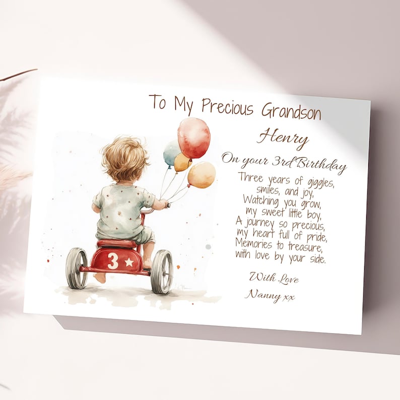 May include: A watercolor illustration of a young child riding a red tricycle with a star and the number 3 on the side. The child is holding a bunch of colorful balloons. The text reads "To My Precious Grandson Henry On your 3rd Birthday Three years of giggles, smiles, and joy, Watching you grow, my sweet little boy, A journey so precious, my heart full of pride, Memories to treasure, with love by your side. With Love Nanny xx"