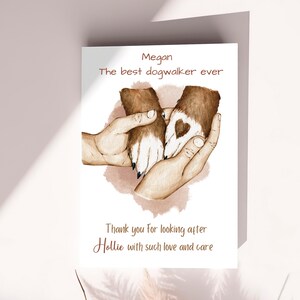 May include: A card with a watercolor illustration of two dog paws with a heart on one paw. The text on the card reads "Megan The best dogwalker ever Thank you for looking after Hollie with such love and care."