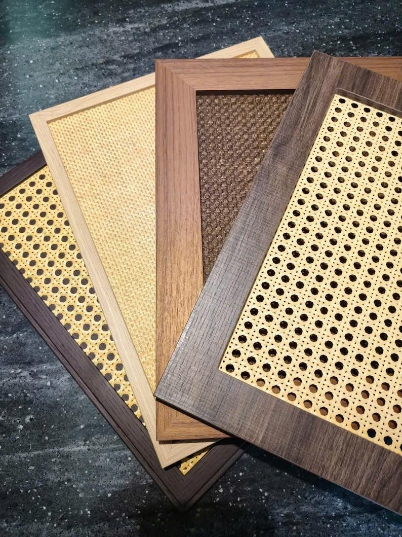 May include: A collection of rectangular wooden frames with woven cane inserts. The frames vary in color, including dark brown, light brown, and natural wood tones. The cane inserts have a light tan color and a patterned design.