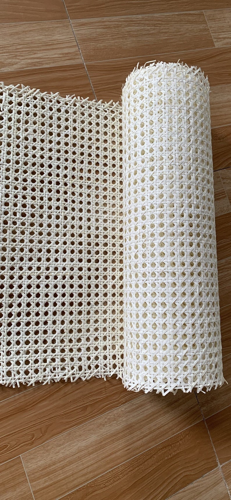 May include: A roll of white cane webbing, a woven material used for chair seats and other furniture upholstery.