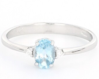 Bague en or 18 carats avec diamant et topaze bleue