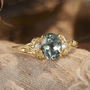ユニークなグリーンサファイアの婚約指輪、花柄の純金リング、自然にインスパイアされたリング、葉っぱのリング、枝の結婚指輪、彼女への記念日の贈り物