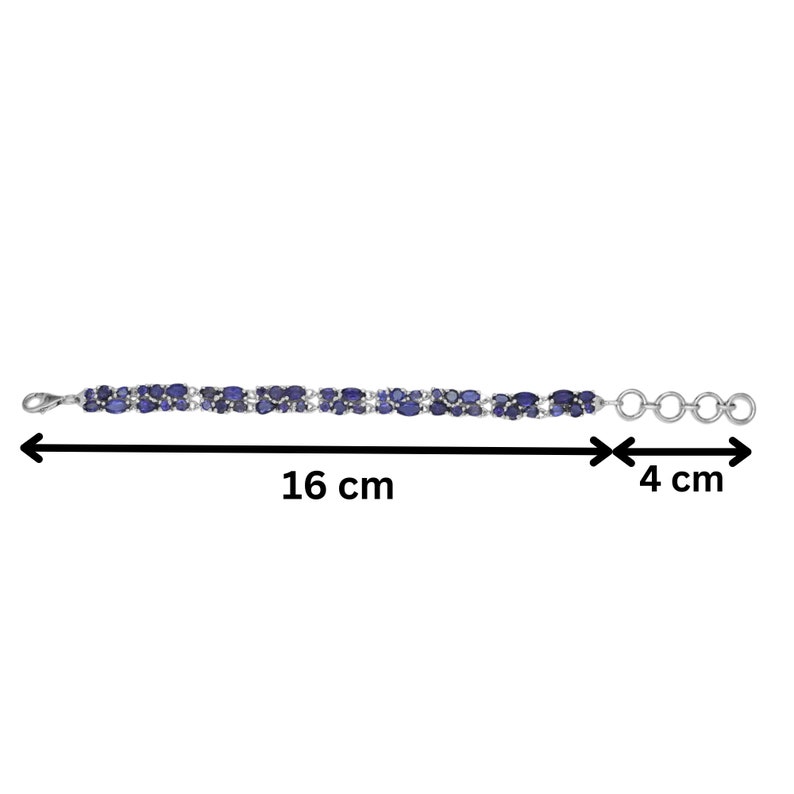 May include: A silver bracelet featuring two rows of oval-shaped, dark blue gemstones. The bracelet is 16 cm (6.3 inches) long and 4 cm (1.6 inches) wide, with a clasp closure and adjustable rings.