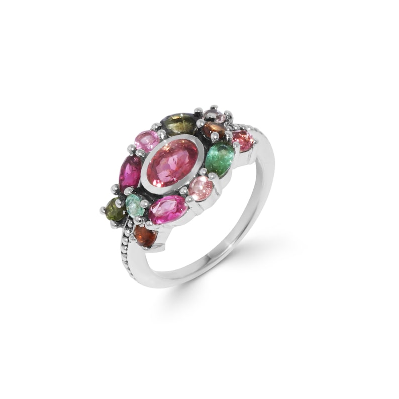 K&ouml;nnte beinhalten: Ein silberner Ring mit einem Cluster aus bunten Edelsteinen, darunter rosa, gr&uuml;n und braun.