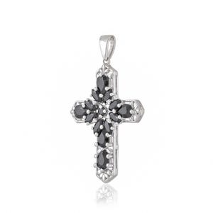 May include: Silver cross pendant with black gemstone accents. The cross is detailed with intricate designs and features a floral pattern.