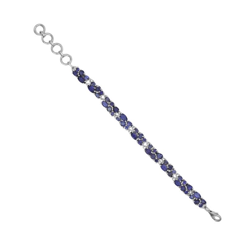 May include: A silver bracelet featuring a series of oval-shaped, deep blue gemstones. The gemstones are interspersed with smaller, clear stones. The bracelet has a delicate design and a secure clasp.