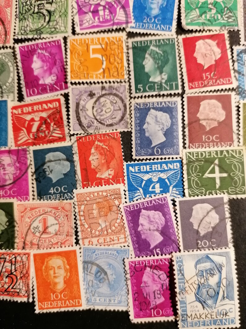 May include: A collection of vintage Dutch postage stamps featuring various designs and denominations. The stamps are in different colors, including red, blue, green, orange, and yellow. Some stamps feature portraits of historical figures, while others depict scenes from Dutch history.