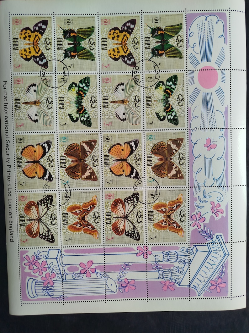 May include: Sheet of postage stamps featuring various butterfly illustrations. The stamps showcase butterflies in shades of yellow, green, orange, brown, and white. The stamps are marked with the word "DUBAI" and the number "60".