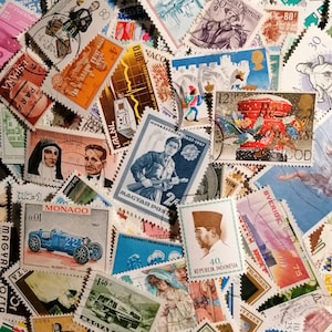 May include: A collection of colorful postage stamps from around the world. The stamps feature a variety of designs, including people, animals, and landmarks. Some of the stamps are from countries such as Monaco, Indonesia, and Sweden.