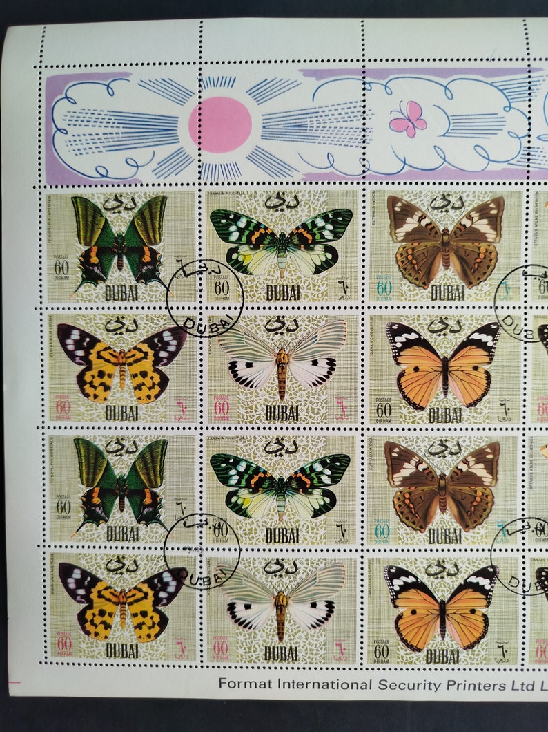 May include: Sheet of postage stamps featuring various butterfly illustrations. Each stamp includes the word "DUBAI" and the number "60". The stamps showcase butterflies in shades of green, brown, yellow, orange, and white.