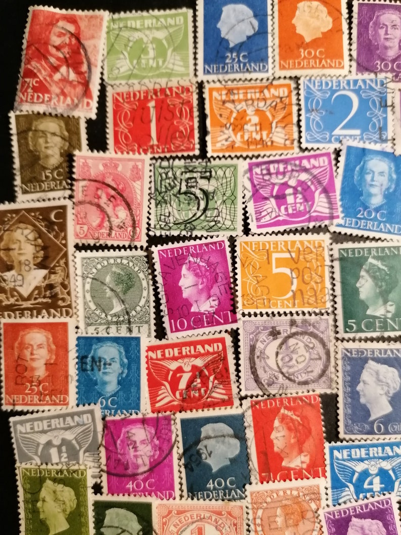 May include: A collection of vintage Dutch postage stamps featuring various designs and denominations. The stamps are in different colors, including red, blue, green, and yellow. Some stamps feature portraits of people, while others feature images of birds, flowers, and other designs. The stamps are in good condition and would be a great addition to any stamp collection.