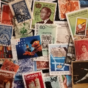 May include: A collection of vintage postage stamps from around the world. The stamps feature a variety of designs, including a Sesame Street character, a building, a candle, and a person. The stamps are in various colors, including red, blue, green, and yellow.