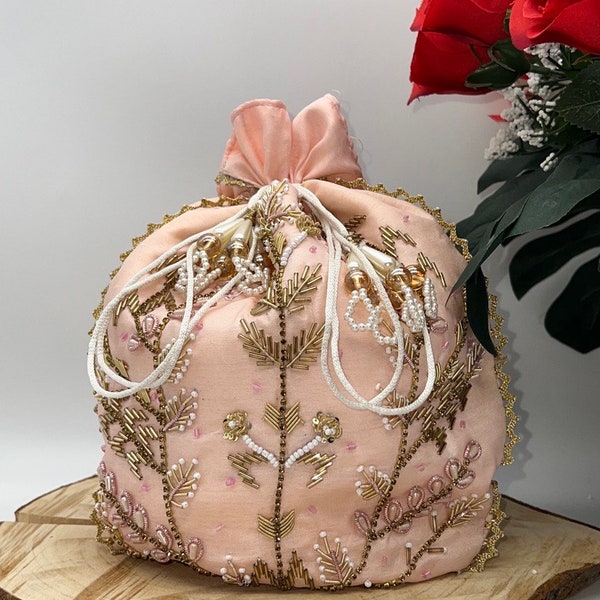 Pink potli bag with gold embroidery designs for Pakistani weddings, party, events, drawstring pouch bag for wrists.