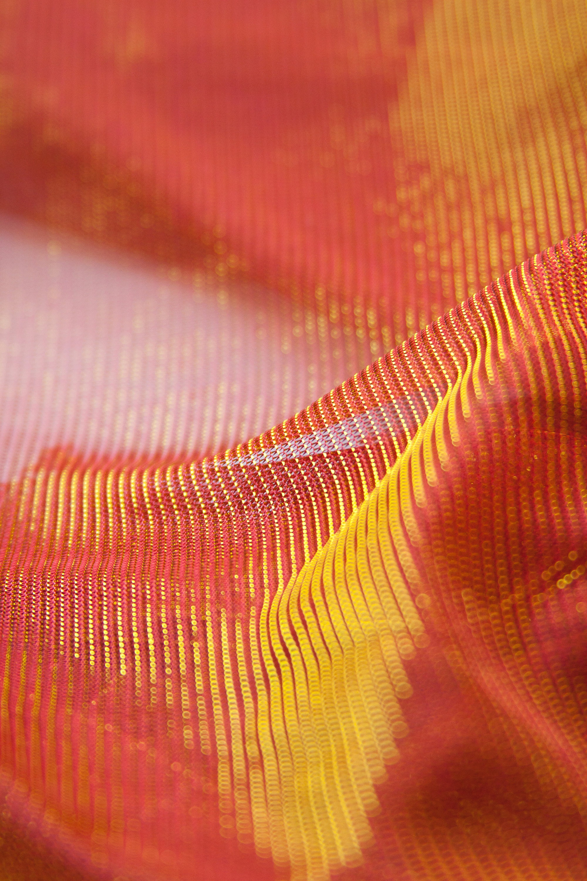 bright gold orange metallic sheer stretch polyester fabric shiny bright orange knit soft fabric see through stretchy chromatic dress fabric