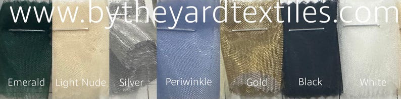 May include: Swatch cards showing eight different colours of fabric: emerald green, light nude, silver, periwinkle blue, gold, black, and white. The website www.bytheyardtextiles.com is printed at the top of the image.