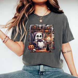 Ghost Reading Book In Library T-Shirt | Unisex Short Sleeve Tee | Comfort Colors 1717 | Halloween Cute Bookworm Teacher Librarian Gift