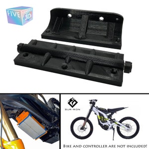 May include: Black 3D-printed mounting brackets for an electric motorcycle. The brackets are designed to hold a battery and controller. The image also includes a Sur-Ron electric bike and the text "BIKE AND CONTROLLER ARE NOT INCLUDED!"