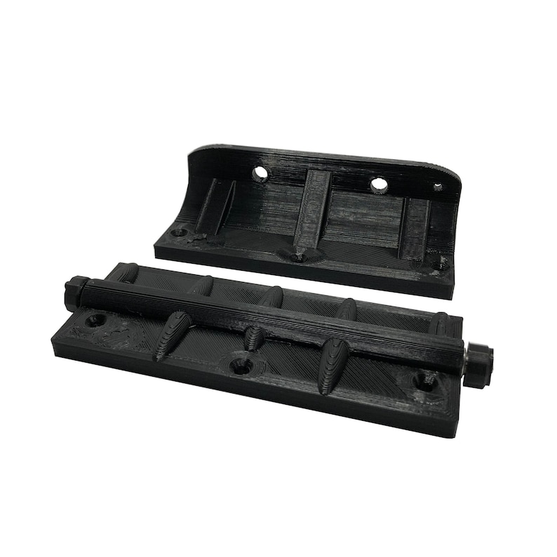 May include: Black 3D-printed hardware components. The image shows a base with a threaded rod and a curved top piece. The base has multiple mounting holes and raised, curved elements. The top piece has two mounting holes.