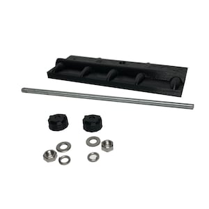 May include: A black, rectangular component with four rounded protrusions, a threaded rod, two black knobs, washers, and nuts. The components are arranged on a white background, suggesting a hardware or mechanical assembly.