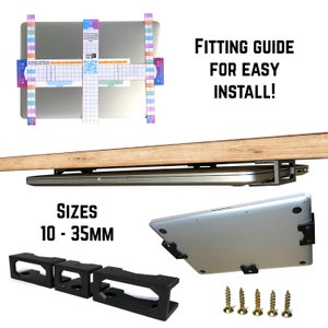May include: A laptop stand with black metal brackets and screws. The stand is designed to attach under a desk or table and hold a laptop. The stand is adjustable to fit laptops with a thickness of 10 to 35 millimetres. The image also shows a laptop attached to the stand and a fitting guide for easy installation.