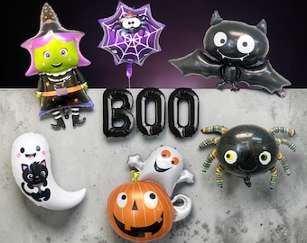 May include: A collection of Halloween-themed foil balloons. Includes a witch, spider web, bat, and spider balloons. Also features a ghost with a black cat, a pumpkin, and the word "BOO" in black balloons.