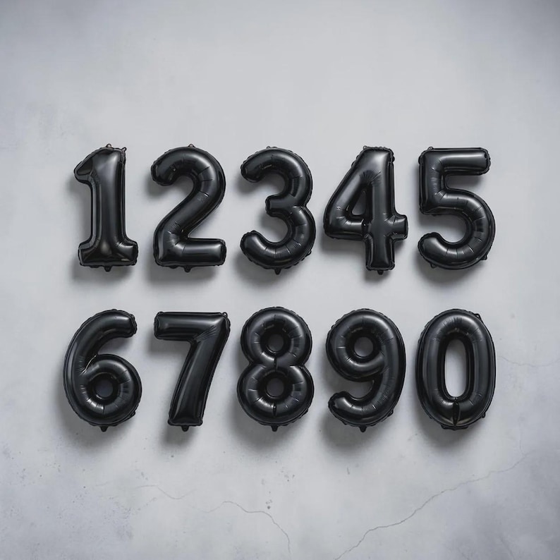 May include: Black number balloons arranged in two rows against a light gray background. The numbers 1 through 5 are in the top row, and 6 through 0 are in the bottom row. These balloons are suitable for birthday parties or anniversaries.