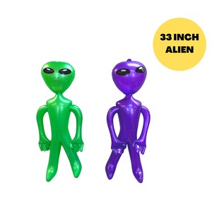 May include: Two inflatable alien figures, one green and one purple, standing on a white background. The text "33 INCH ALIEN" is written on a yellow circle.