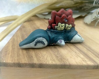 Dingy, stuffed Cyndaquil friend figurine