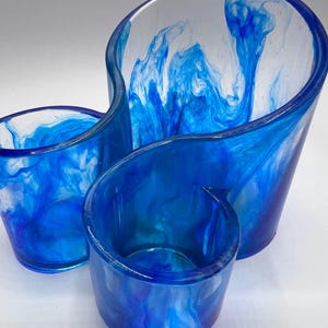 May include: A blue and white resin organiser with three compartments. The organiser has a swirled design with blue and white colours.