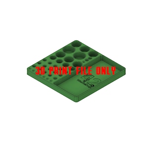 May include: A green 3D printed organizer with multiple circular compartments and a larger rectangular compartment. The organizer has the text "3D PRINT FILE ONLY" and "Workshop 42" printed on it.