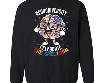 May include: Black sweatshirt with the words "NEURODIVERSITY" and "CELEBRATE THE SPECTRUM" in white and rainbow colors. The graphic features a smiling brain wearing glasses and giving a thumbs up.