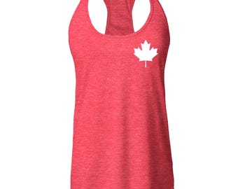 May include: Red racerback tank top with a white Canadian maple leaf graphic on the left side.