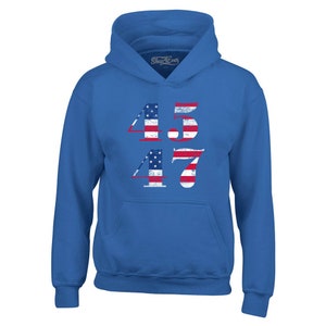 May include: A royal blue hooded sweatshirt with the numbers 45 and 47 printed on the front. The numbers are in a distressed style and are made up of the American flag.